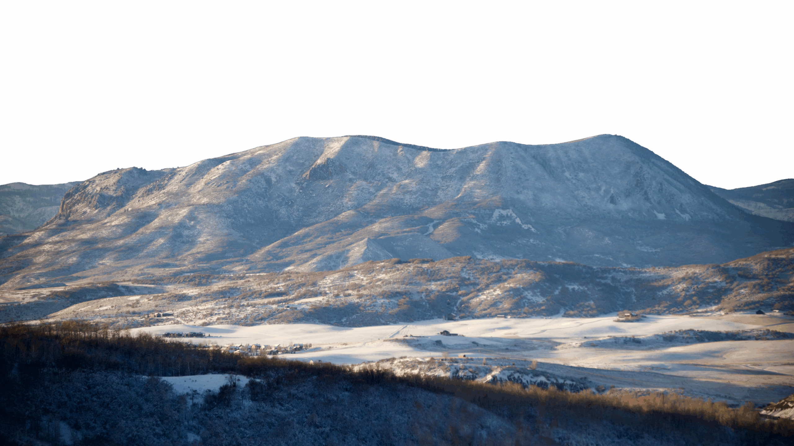 a snowy mountain range with a black background