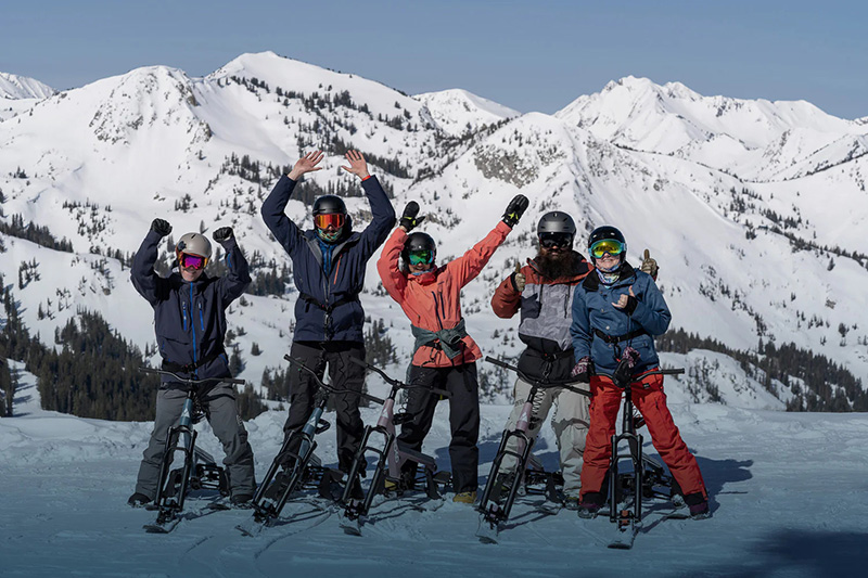 a group of people posing for a picture in the snow